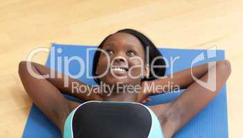 Happy woman in gym outfit excercising