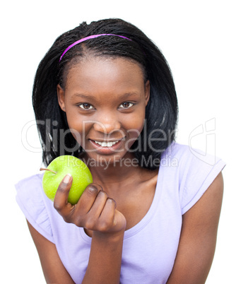 Smiling young woman eating an apple