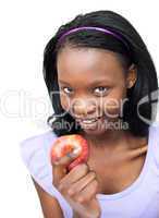 Attractive young woman eating an apple