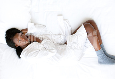 Chaming woman lying on her bed