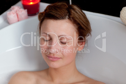 Beautiful woman relaxing in a bath