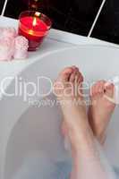 Close-up of woman's feet in a bath