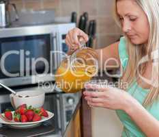 Attractive woman having an healthy breakfast in a kitchen