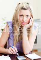 Upset woman paying her bills