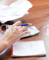 Close-up of a woman paying her bills
