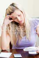 Frustrated woman paying her bills