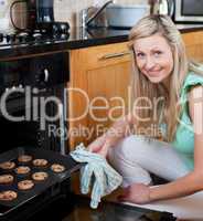 Happy woman baking cookies