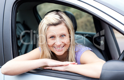 Portrait of a happy young female driver