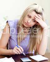 Stressed woman paying her bills