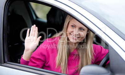 Cheerful female driver at the wheel