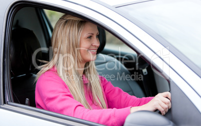 Attractive female driver at the wheel