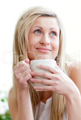Portrait of a beautiful young woman drinking a coffe
