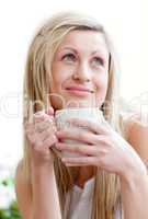 Portrait of a beautiful young woman drinking a coffe