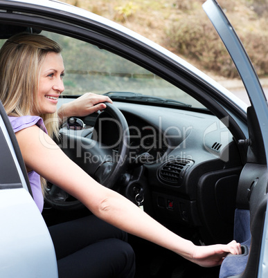 Jolly female driver at the wheel