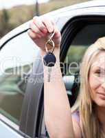 A driver holding a key after bying a new car