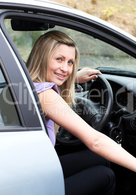 Young female driver at the wheel