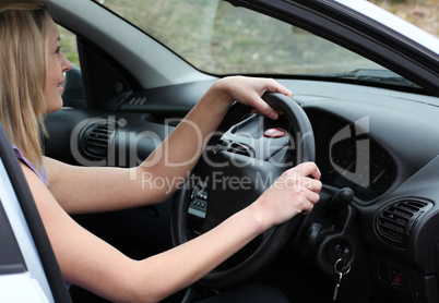 Charming female driver at the wheel
