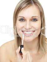 Smiling woman putting gloss