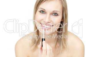 Delighted woman putting gloss