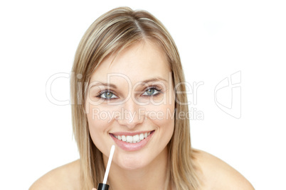 Delighted woman putting gloss