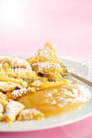 Austrian sweet dessert called kaiserschmarrn with apple sauce