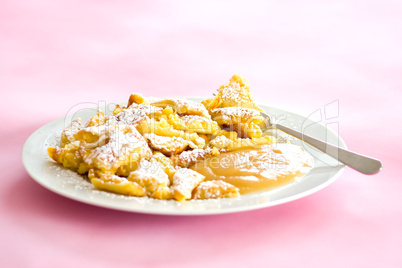 Austrian sweet dessert called kaiserschmarrn with apple sauce