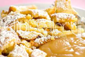 Austrian sweet dessert called kaiserschmarrn with apple sauce