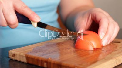 Cutting of tomato for salad.