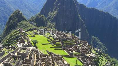 Time Lapse Movie over ruins of Machu Picchu in Peru with some tourists walking by