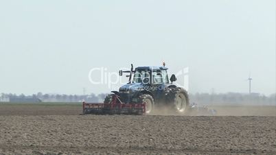 farmer plows his land before seeding