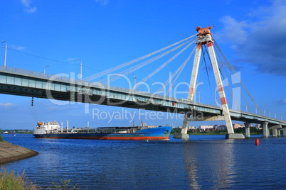 oil tanker under the cable-stayed bridge