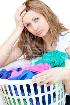 Tired woman doing laundry