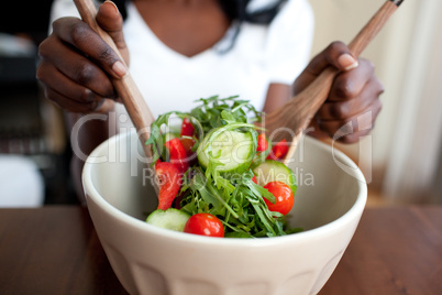Ethnic woman preparing a salad