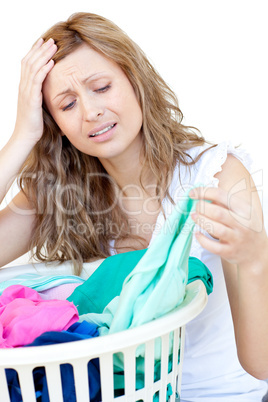 Disapointed woman doing laundry