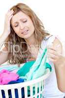 Disapointed woman doing laundry