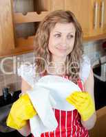 Smiling caucasian woman drying dishes