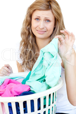 Upset woman doing laundry