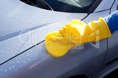 Woman cleaning her car