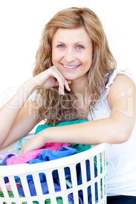 Happy woman doing laundry