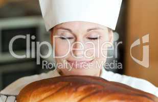 Radiant female chef baking bread