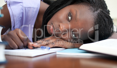 Exhausted teen girl resting while studying