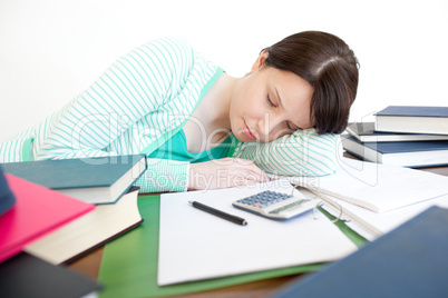 Exhausted student sleeping while studying