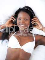 Bright woman in underwear listening music
