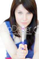 Charming woman holding a toothbrush