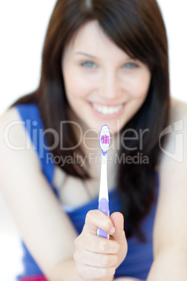 Pretty woman holding a toothbrush
