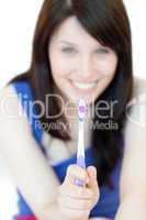 Pretty woman holding a toothbrush