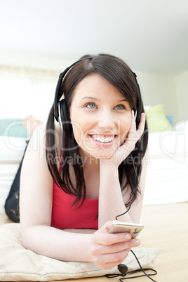 Jolly woman listening music with headphones on