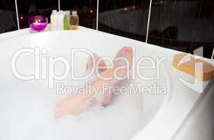 Woman's feet in a bubble bath
