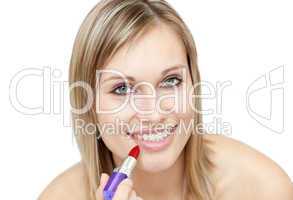 Glowing woman putting red lipstick