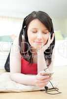 Bright woman listening music with headphones on